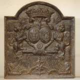 Cast iron fireback with two lions