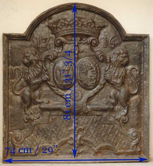 Cast iron fireback with two lions