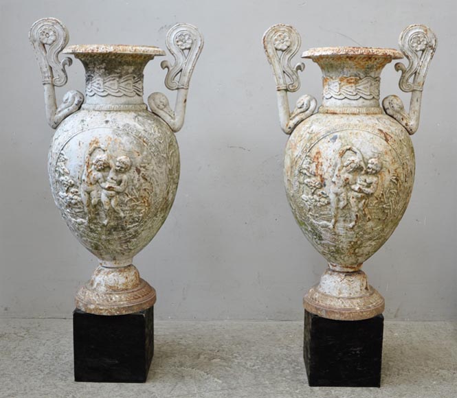 Antique pair of cast iron vases with putti-0