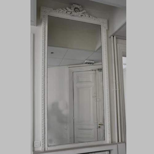 Antique Louis XVI style pier glass with quiver and flowers decor