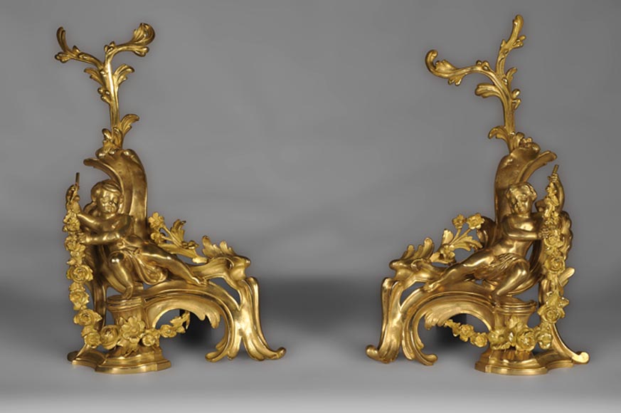 Antique Louis XV style andirons made out of gilded bronze with putti decor Antique Louis XV style andirons made out of gilded bronze with putti decor-0