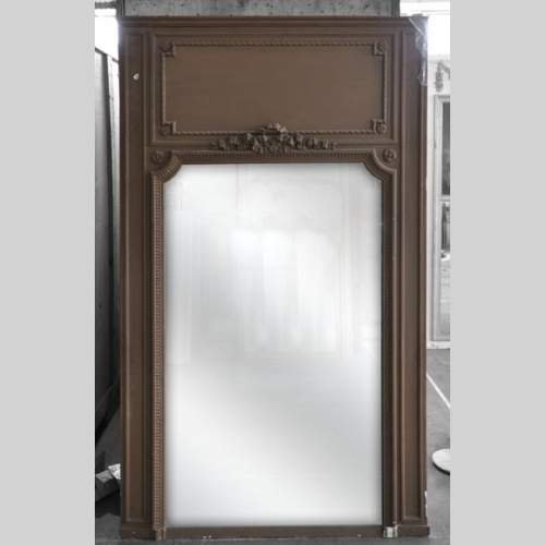 Antique Louis XVI overmantel ornamented with paterae and bow