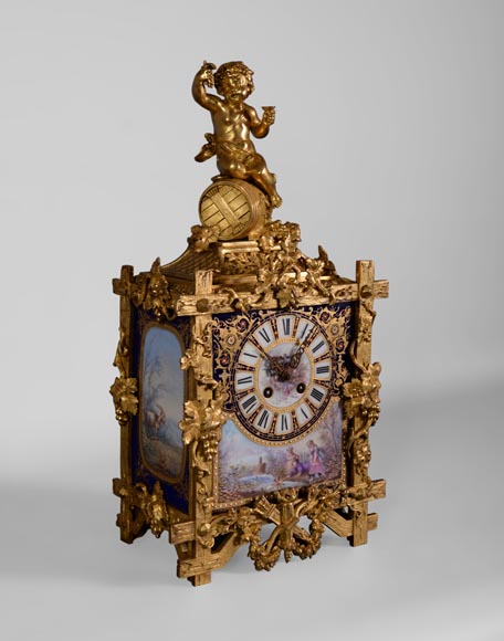 A Napoleon III style clock made out of porcelain and gilded bronze representing Bacchus, god of wine A Napoleon III style clock made out of porcelain and gilded bronze representing Bacchus, god of wine-1