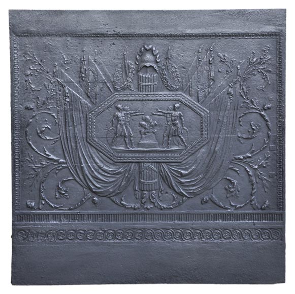 Antique large cast iron fireback inspired by  Antique large cast iron fireback inspired by