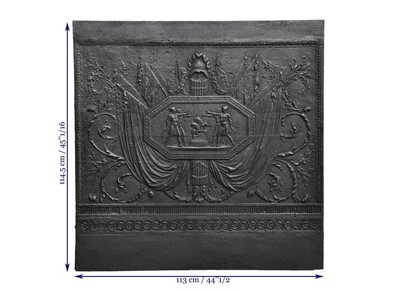 Antique large cast iron fireback inspired by  Antique large cast iron fireback inspired by