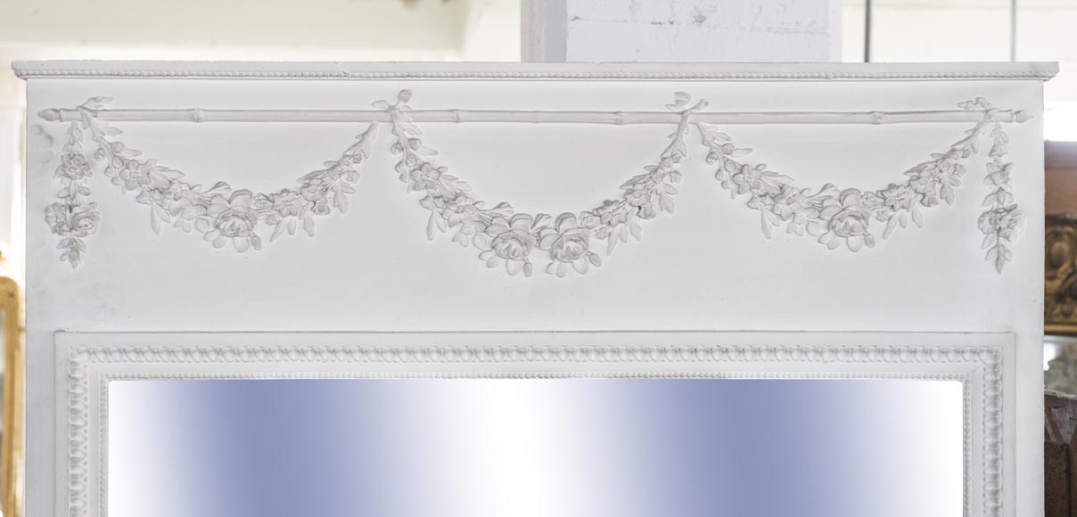 An antique large trumeau with garlands of flowers An antique large trumeau with garlands of flowers-1