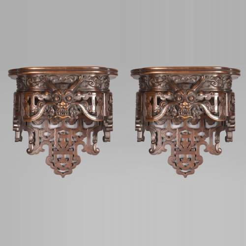 Pair of Far Eastern wall brackets with dragon decoration.