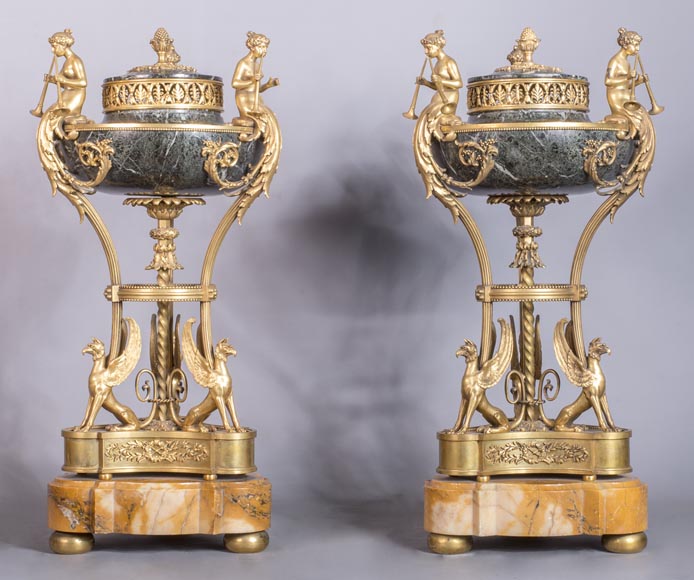 Pair of cassolettes with blowers and griffins, in Napoleon III style, in Vert de Mer, Jaune de Sienne marble and gilded bronze. Pair of cassolettes with blowers and griffins, in Napoleon III style, in Vert de Mer, Jaune de Sienne marble and gilded bronze.-0
