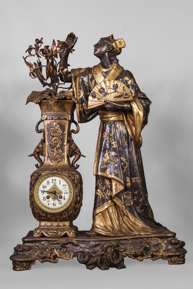 Arthur WAAGEN (active 1869-1910) Japanese-style clock set, made out of spelter, representing a young woman dressed in a kimono Arthur WAAGEN (active 1869-1910) Japanese-style clock set, made out of spelter, representing a young woman dressed in a kimono-1