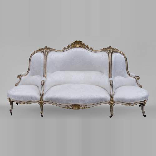 A large Louis XV style bench made out of gilded wood