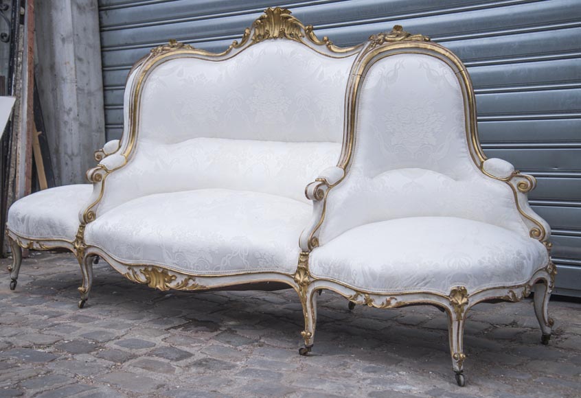 A large Louis XV style bench made out of gilded wood A large Louis XV style bench made out of gilded wood-4