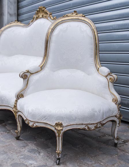 A large Louis XV style bench made out of gilded wood A large Louis XV style bench made out of gilded wood-5