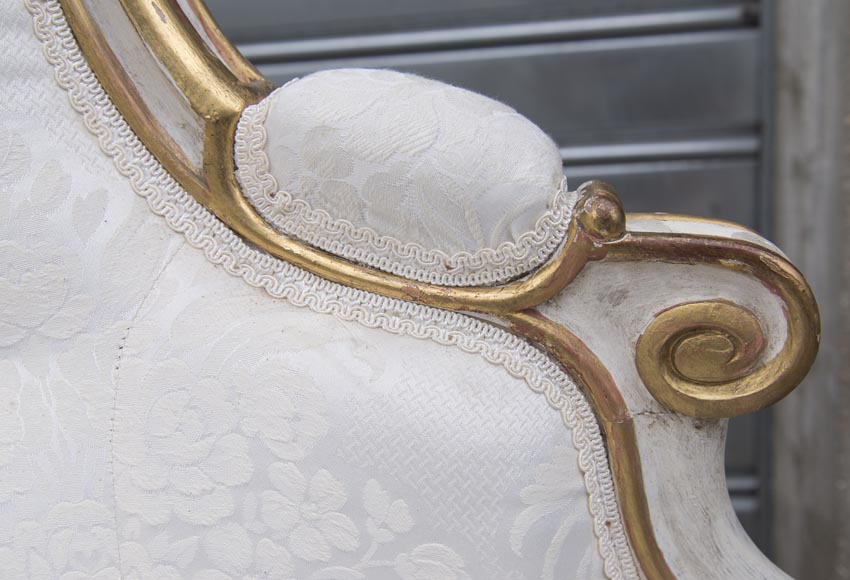 A large Louis XV style bench made out of gilded wood A large Louis XV style bench made out of gilded wood-7