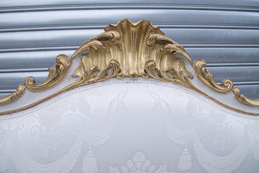 A large Louis XV style bench made out of gilded wood A large Louis XV style bench made out of gilded wood-11