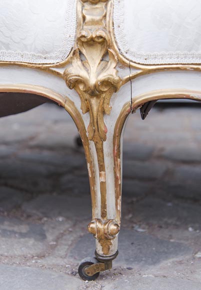 A large Louis XV style bench made out of gilded wood A large Louis XV style bench made out of gilded wood-12