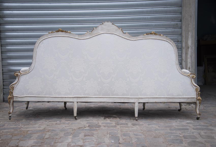 A large Louis XV style bench made out of gilded wood A large Louis XV style bench made out of gilded wood-14