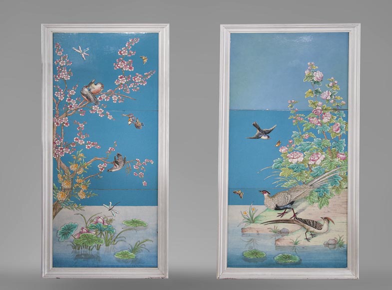 A pair of ceramic panels with birds in a lacustrine scenery signed A pair of ceramic panels with birds in a lacustrine scenery signed