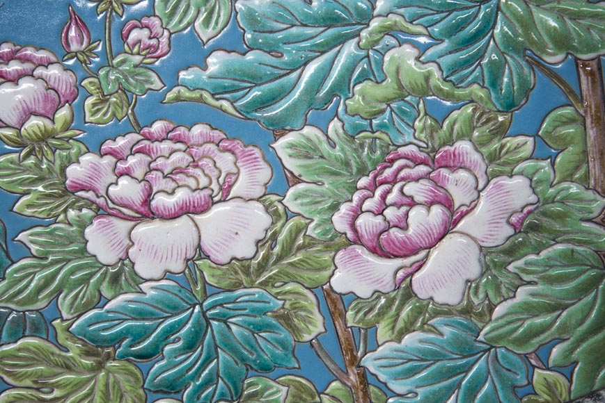 A pair of ceramic panels with birds in a lacustrine scenery signed A pair of ceramic panels with birds in a lacustrine scenery signed