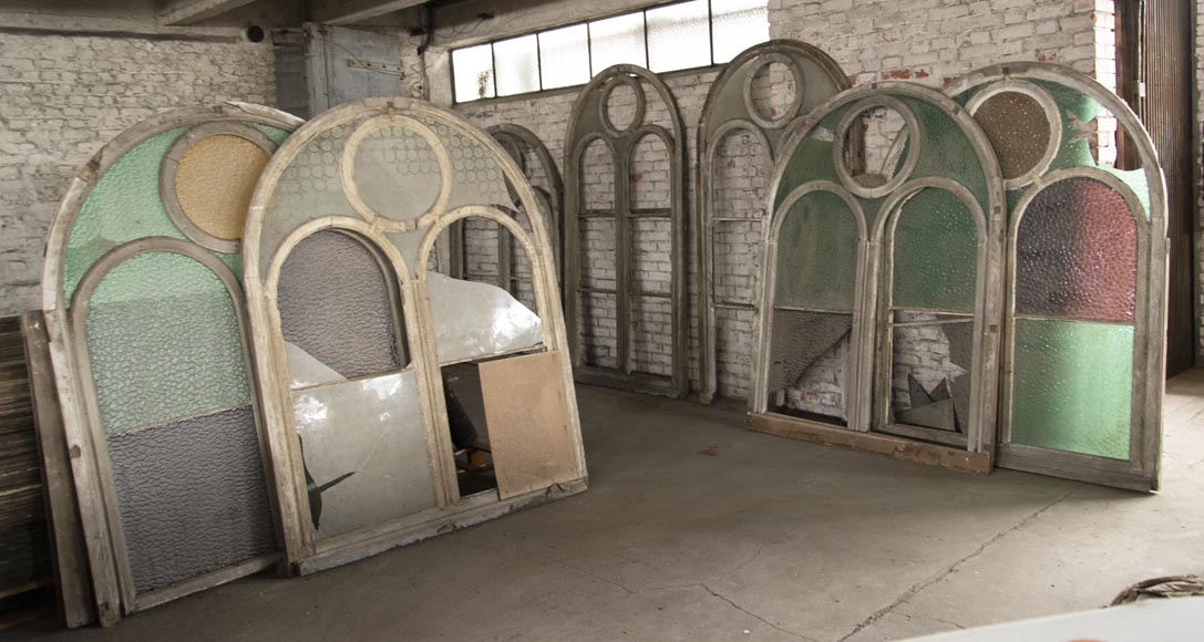 Arched wooden window frames and coloured glass Arched wooden window frames and coloured glass-0