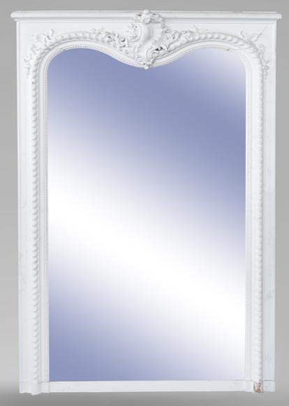 An antique Louis XV style overmantel with asymetric shell and crossbow pediment An antique Louis XV style overmantel with asymetric shell and crossbow pediment-0