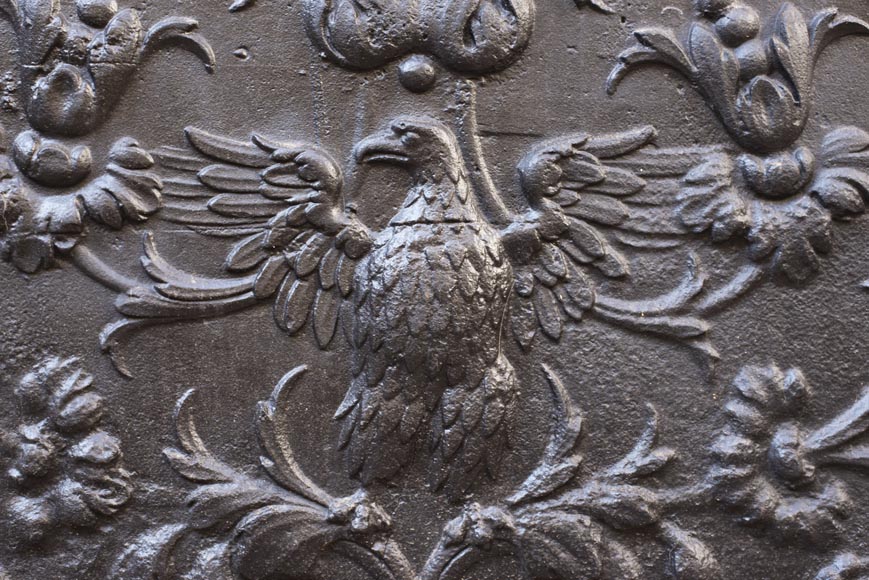 18th century fireback with phoenix decoration among flowers and scrolls. 18th century fireback with phoenix decoration among flowers and scrolls.-1