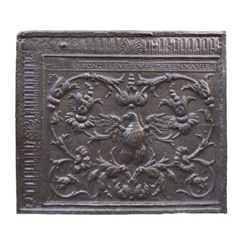 18th century fireback with phoenix decoration among flowers and scrolls.