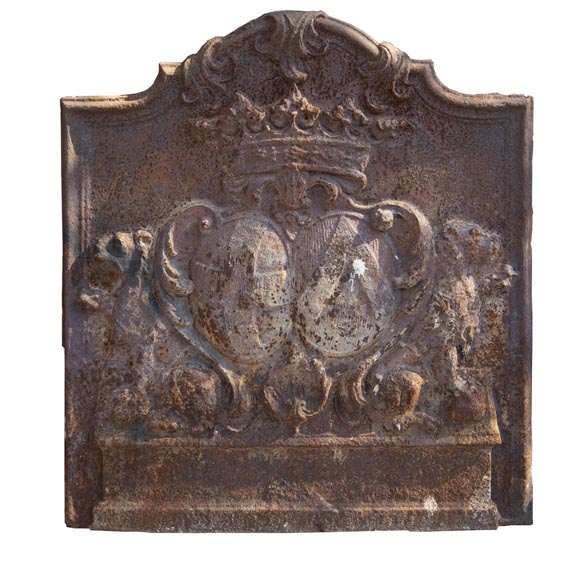 An old 18th century fireback with coat of arms and sitting lions An old 18th century fireback with coat of arms and sitting lions-0