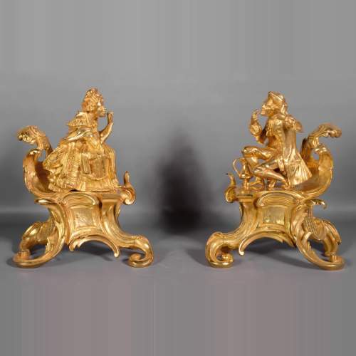 Pair of antique Louis XV style gilt bronze andirons with characters in costume