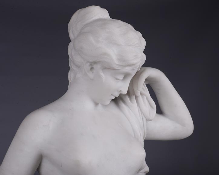 Peach blossom marble and gilt bronze clock surmounted by a statuary white marble   sculpture representing Phryne in front of his judges signed  Peach blossom marble and gilt bronze clock surmounted by a statuary white marble   sculpture representing Phryne in front of his judges signed