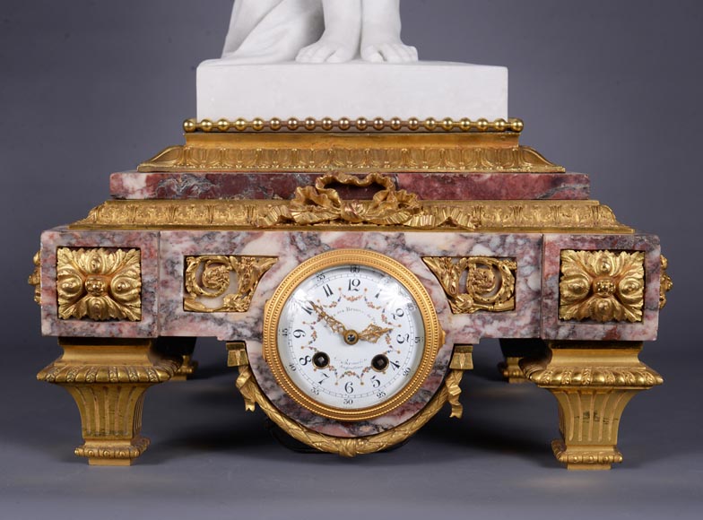 Peach blossom marble and gilt bronze clock surmounted by a statuary white marble   sculpture representing Phryne in front of his judges signed  Peach blossom marble and gilt bronze clock surmounted by a statuary white marble   sculpture representing Phryne in front of his judges signed