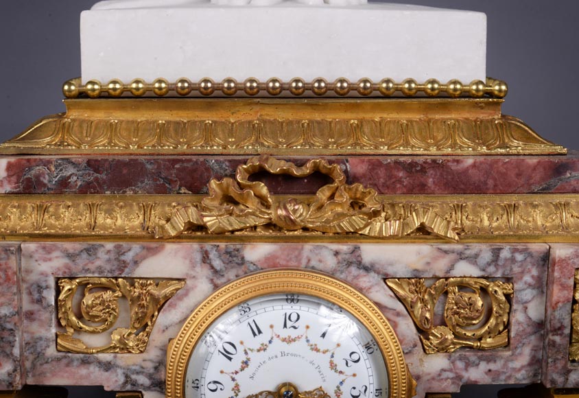 Peach blossom marble and gilt bronze clock surmounted by a statuary white marble   sculpture representing Phryne in front of his judges signed  Peach blossom marble and gilt bronze clock surmounted by a statuary white marble   sculpture representing Phryne in front of his judges signed