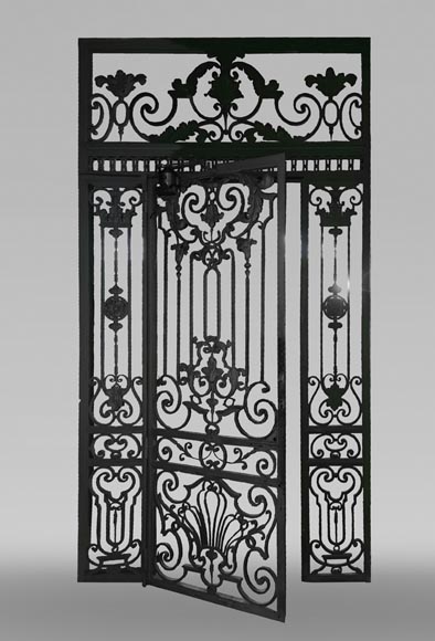 Old wrought iron entrance door of a Napoleon III period mansion. Old wrought iron entrance door of a Napoleon III period mansion.-0