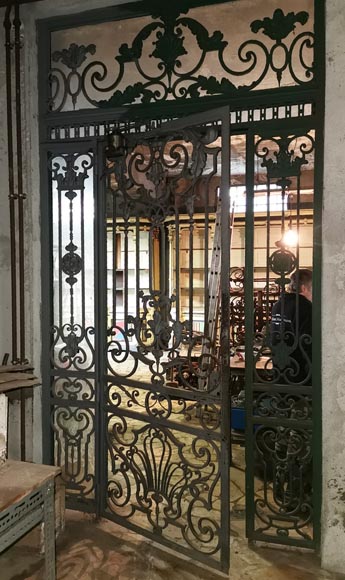 Old wrought iron entrance door of a Napoleon III period mansion. Old wrought iron entrance door of a Napoleon III period mansion.-1