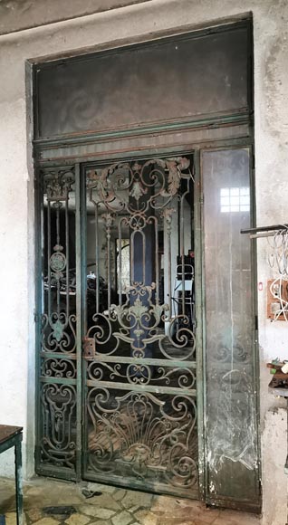 Old wrought iron entrance door of a Napoleon III period mansion. Old wrought iron entrance door of a Napoleon III period mansion.-2