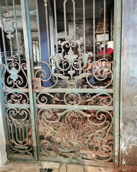 Old wrought iron entrance door of a Napoleon III period mansion. Old wrought iron entrance door of a Napoleon III period mansion.-4