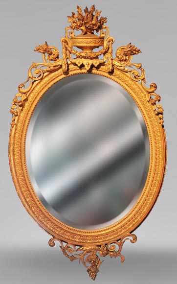 Louis XVI oval mirror in gilt wood with a vase and flowers Louis XVI oval mirror in gilt wood with a vase and flowers-0