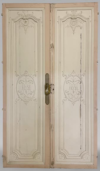 Beautiful sculpted wood double door with a monogram Beautiful sculpted wood double door with a monogram-0
