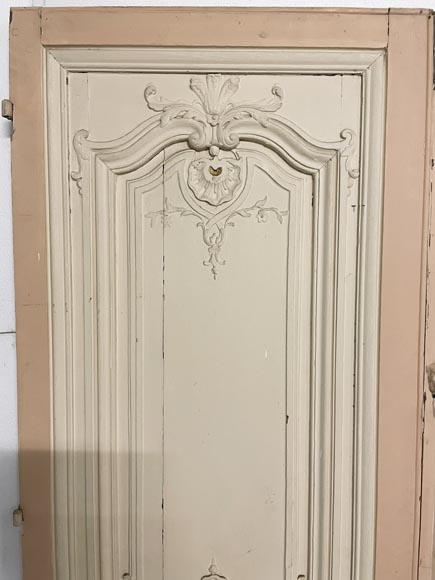 Beautiful sculpted wood double door with a monogram Beautiful sculpted wood double door with a monogram-1