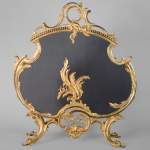 Louis XV style gilded bronze firescreen with plant decoration