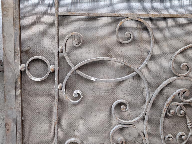 Pair of wrought iron front radiators with intertwined L Pair of wrought iron front radiators with intertwined L-4