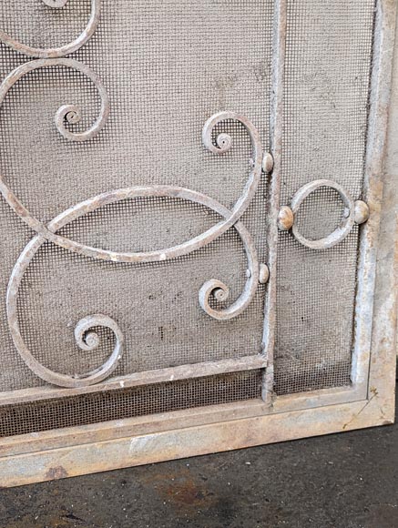 Pair of wrought iron front radiators with intertwined L Pair of wrought iron front radiators with intertwined L-8