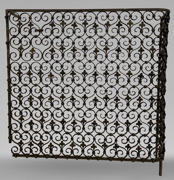 Wrought iron radiator railing decorated with volutes and fleur-de-lis Wrought iron radiator railing decorated with volutes and fleur-de-lis-0