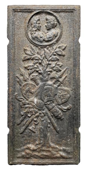 17th century fireback decorated with a warrior trophy surmounted by a medallion with a double portrait 17th century fireback decorated with a warrior trophy surmounted by a medallion with a double portrait-0