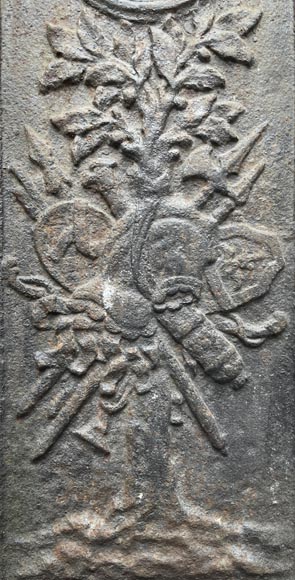 17th century fireback decorated with a warrior trophy surmounted by a medallion with a double portrait 17th century fireback decorated with a warrior trophy surmounted by a medallion with a double portrait-1