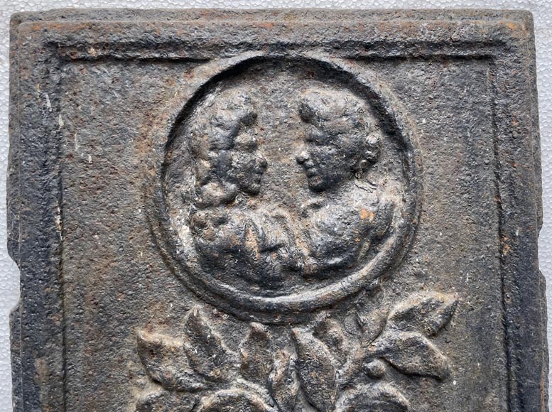 17th century fireback decorated with a warrior trophy surmounted by a medallion with a double portrait 17th century fireback decorated with a warrior trophy surmounted by a medallion with a double portrait-2