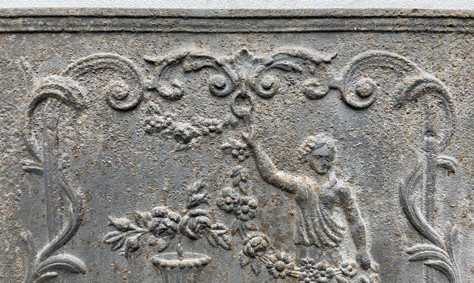 18th century fireback representing a female figure with a flower garland next to an antique vase 18th century fireback representing a female figure with a flower garland next to an antique vase-5