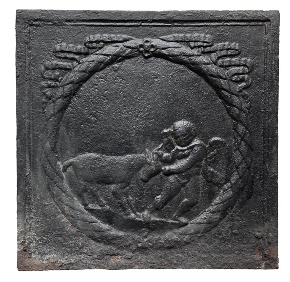 Fireback from the 18th century featuring a love playing with a goat Fireback from the 18th century featuring a love playing with a goat-0
