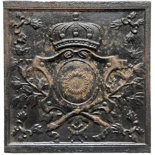 Fireback from the 19th century with a shield decorated with a sunflower