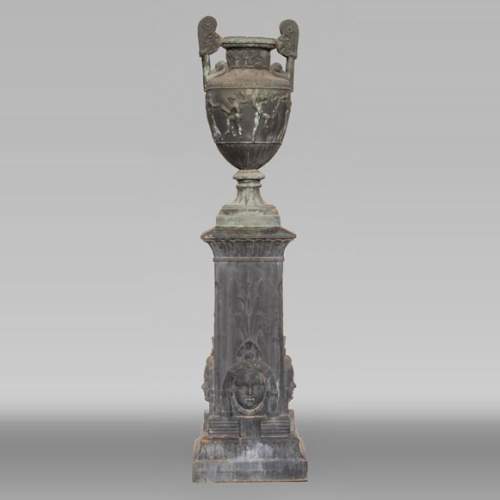 Greek style vase and its egyptian base, cast iron