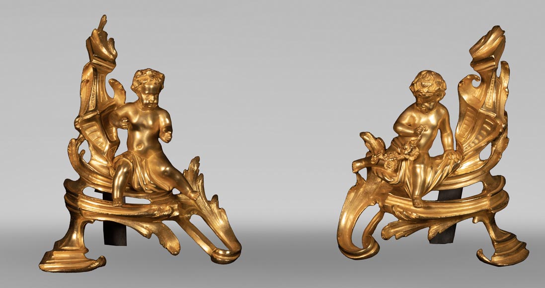 Pair of Louis XV style andirons with putti decoration Pair of Louis XV style andirons with putti decoration-0